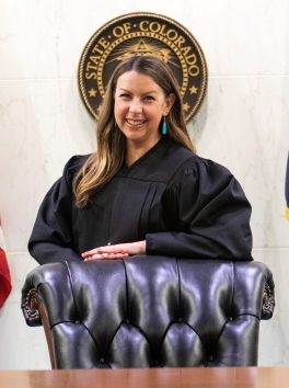 Photo of Judge Brown in a Courtroom.  She is wearing a judicial robe.